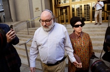Convicted spy Jonathan Pollard and his wife, Esther, leave the federal courthouse in New York, Nov. 20, 2015. Within hours of his release, Pollard's attorneys began a court challenge to terms of his parole. He served 30 years for selling intelligence
