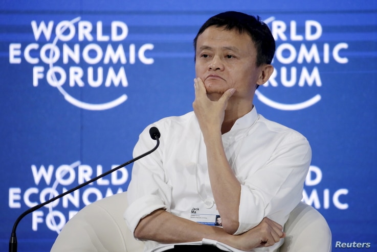 Chairman and chief executive of Alibaba Group Jack Ma reacts during a session of 