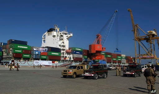 A loaded Chinese ship is readied for departure during a ceremony at Gwadar port, about 435 miles, 700 km, west of Karachi…