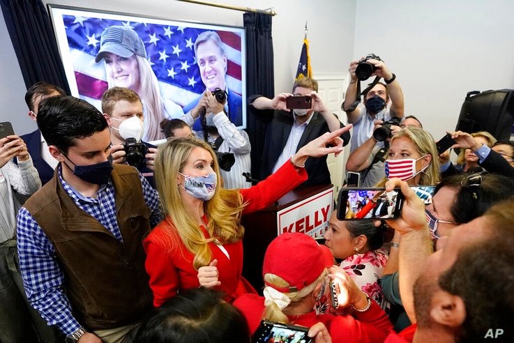 Republican candidate for U.S. Senate Sen. Kelly Loeffler gestures to supporters after speaking at a campaign rally Wednesday,…