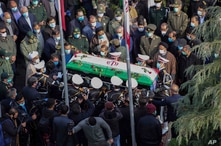 Military personnel carry the coffin of Mohsen Fakhrizadeh, an Iranian scientist killed on Friday, at a funeral ceremony in Tehran, Nov. 30, 2020.