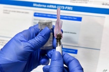 FILE - In this July 27, 2020 photo, a nurse prepares a syringe during a study of a possible COVID-19 vaccine in Binghamton, N.Y.