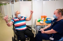 Henry (Jack) Vokes, 98, reacts receiving the Pfizer-BioNTech COVID-19 vaccine at Southmead Hospital, Bristol, England.