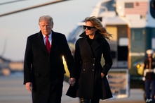 President Donald Trump and first lady Melania Trump board Air Force One at Andrews Air Force Base, Md., Dec. 23, 2020. Trump raveled to his Mar-a-Lago resort in Palm Beach, Florida. 