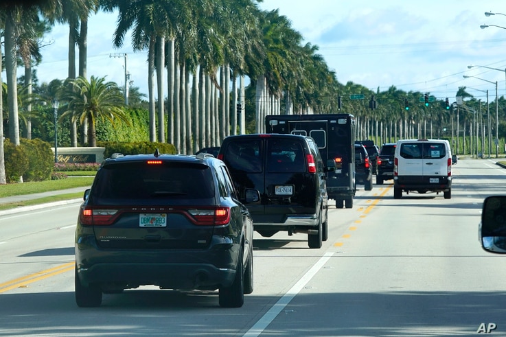 President Donald Trump's motorcade drives to Trump International Golf Club, Friday, Dec. 25, 2020, in West Palm Beach, Fla. (AP…