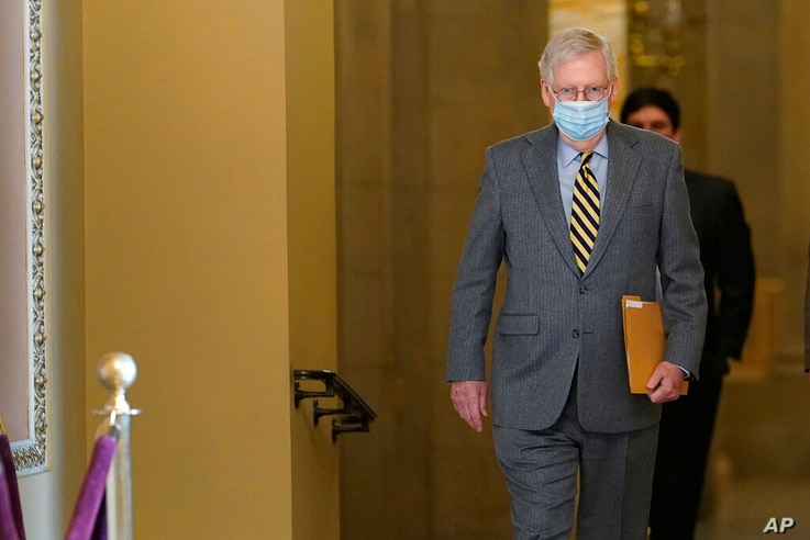 Senate Majority Leader Mitch McConnell of Ky., walks to the Senate floor on Capitol Hill in Washington, Wednesday, Dec. 30,…