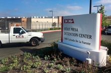 FILE - A vehicle drives into the Otay Mesa detention center in San Diego.