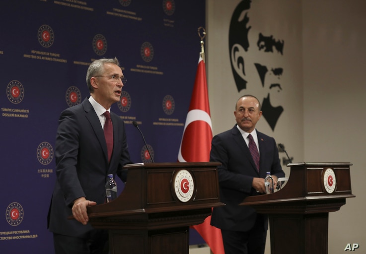 NATO Secretary-General Jens Stoltenberg, left, and Turkey's Foreign Minister Mevlut Cavusoglu speak to the media after their talks in Ankara, Turkey, Oct. 5, 2020.