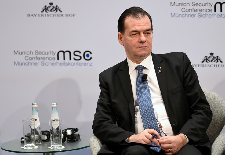 FILE PHOTO: Romania's Prime Minister Ludovic Orban listens during a panel discussion at the annual Munich Security Conference…