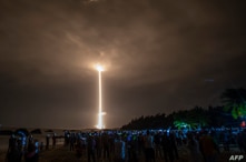 A Long March 5 rocket carrying China's Chang'e-5 lunar probe launches from the Wenchang Space Center on China's southern Hainan Island, Nov. 24, 2020, on a mission to bring back lunar rocks.