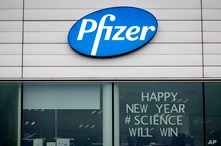 A sign in the window of an office at Pfizer Manufacturing in Puurs, Belgium, Dec. 21, 2020.