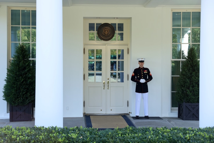 A U.S. Marine is posted at the West Wing door, an indication that President Donald Trump is in the Oval Office as he remains out of public view while fighting the coronavirus disease COVID-19, at the White House in Washington, Oct. 7, 2020.