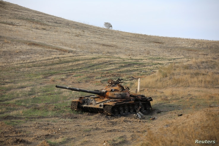A view shows a burnt tank near Hadrut town, which recently came under the control of Azerbaijan's troops following a military conflict against ethnic Armenian forces, in the region of Nagorno-Karabakh, Nov. 25, 2020.