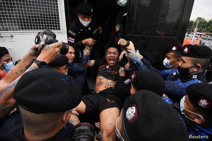 FILE - Police detain pro-democracy protester Jatupat 