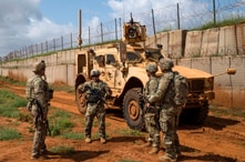 FILE - U.S. Army soldiers discuss security operations during a patrol in Somalia in December 2019. (Nick Kibbey/U.S. Air Force)
