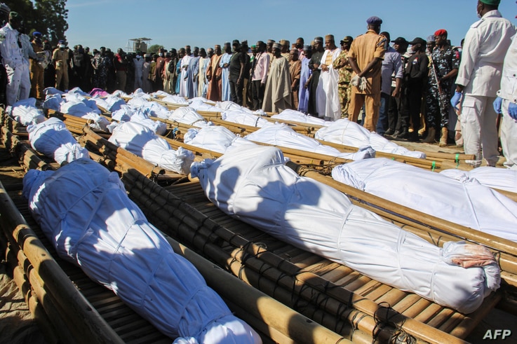 Mourners attend the funeral of 43 farm workers in Zabarmari, about 20km from Maiduguri, Nigeria, on November 29, 2020 after…