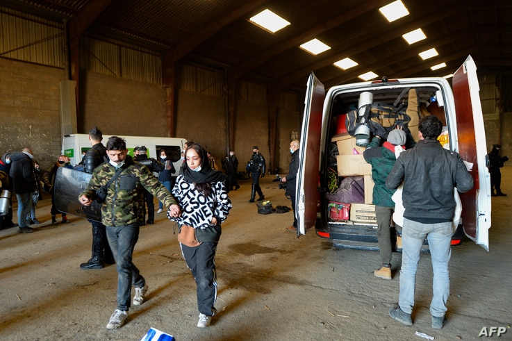 French Gendarmes evacuate the last partygoers who attended a rave in a disused hangar in Lieuron about 40km (around 24 miles)…