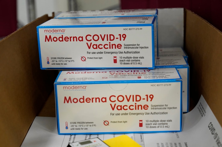 Boxes containing the Moderna COVID-19 vaccine are prepared to be shipped at the McKesson distribution center in Olive Branch,…