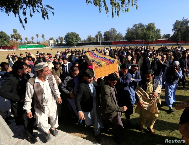 Afghan men carry the coffin of journalist Malalai Maiwand, who was shot and killed by unknown gunmen in Jalalabad, Afghanistan…