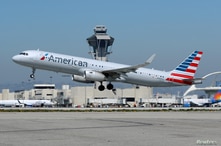 FILE PHOTO: An American Airlines Airbus A321-200 plane takes off from Los Angeles International airport (LAX) in Los Angeles,…