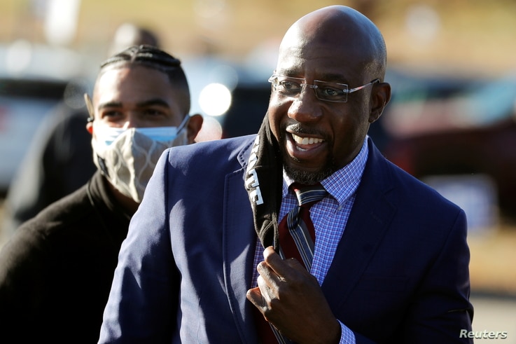 Democrat Rev. Raphael Warnock arrives at a campaign rally in Augusta, Georgia, January 4, 2021.