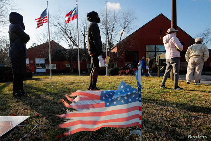 Voters line up for the U.S. Senate run-off election, at a polling location in Marietta, Georgia, Jan. 5, 2021. 