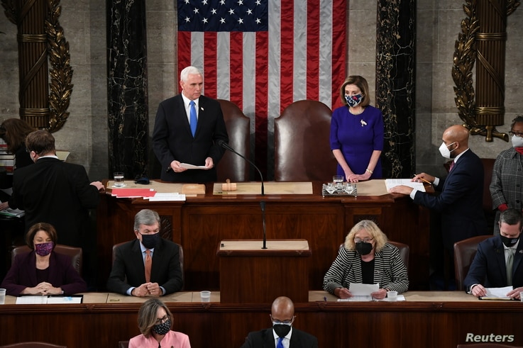 U.S. Vice President Mike Pence and Speaker of the House Nancy Pelosi (D-CA) take part in a joint session of Congress.