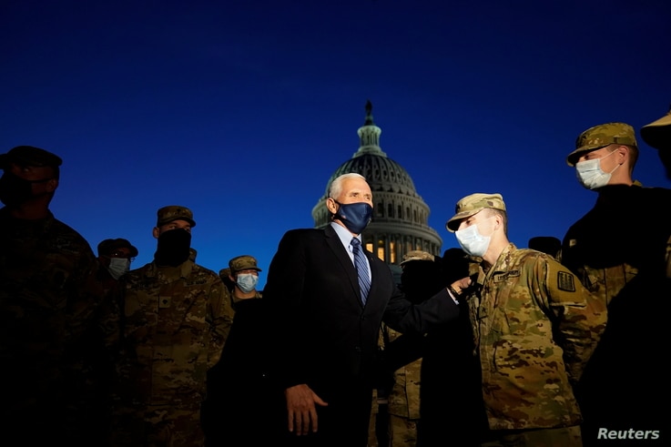 Vice President Mike Pence speaks to National Guard troops outside the U.S. Capitol, January 14, 2021, in Washington. Alex…