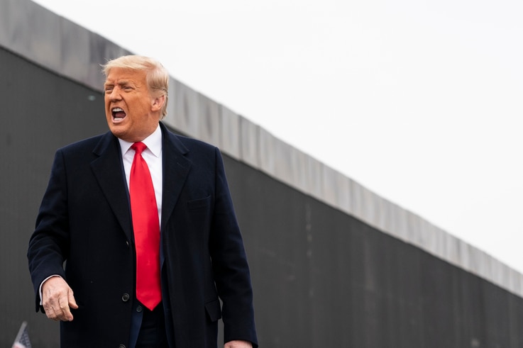 President Donald Trump reacts after speaking near a section of the U.S.-Mexico border wall, Tuesday, Jan. 12, 2021, in Alamo,…