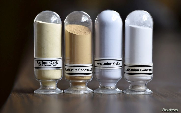 FILE - Samples of rare earth minerals from left, Cerium oxide, Bastnasite, Neodymium oxide and Lanthanum carbonate are on display during a tour of Molycorp's Mountain Pass Rare Earth facility in Mountain Pass, California, June 29, 2015.  