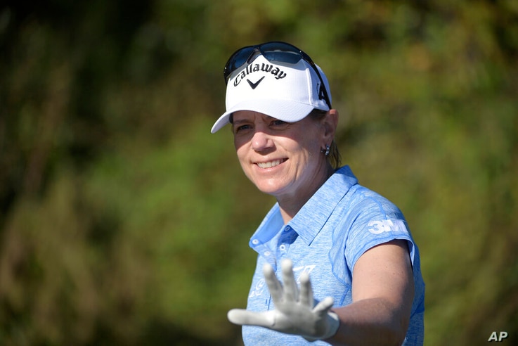 FILE - In this Dec. 7, 2019, file photo, Annika Sorenstam, of Sweden, waves to spectators after teeing off on the first hole…