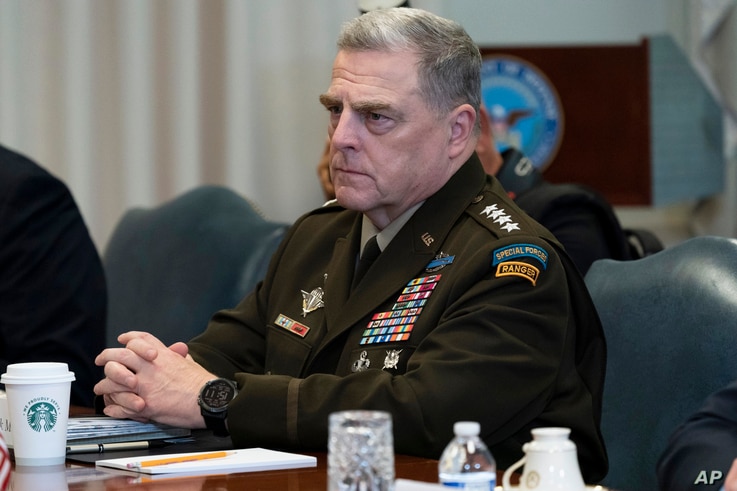 FILE - In this Sept. 22, 2020, file photo Joint Chiefs Chairman Gen. Mark Milley listens before a meeting with Secretary of…