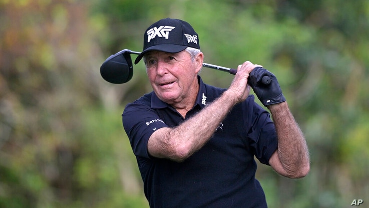 Gary Player, of South Africa, watches his tee shot on the first hole during the final round of the PNC Championship golf…