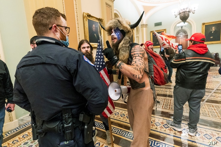 FILE - In this Jan. 6, 2021, file photo supporters of President Donald Trump are confronted by U.S. Capitol Police officers…