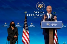 President-elect Joe Biden speaks about the COVID-19 pandemic during an event at The Queen theater, Thursday, Jan. 14, 2021, in…