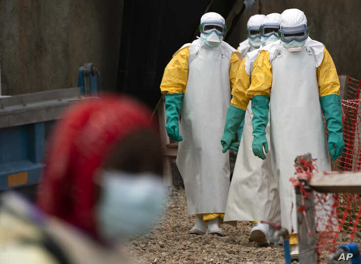 FILE - Health workers begin their shift at an Ebola treatment center in Beni, Democratic Republic of Congo, July 16, 2019. The Ebola outbreak has been declared an international emergency after it spread to eastern Congo's biggest city, Goma, this week. 