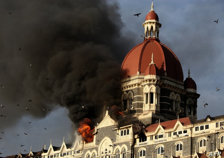 Flames gushing out of The Taj Mahal Hotel in Mumbai on November 27, 2008. Indian police have arrested a key suspect accused of co-coordinating the 2008 Mumbai terror attacks in which 166 people were killed and more than 300 wounded, media reports sai...