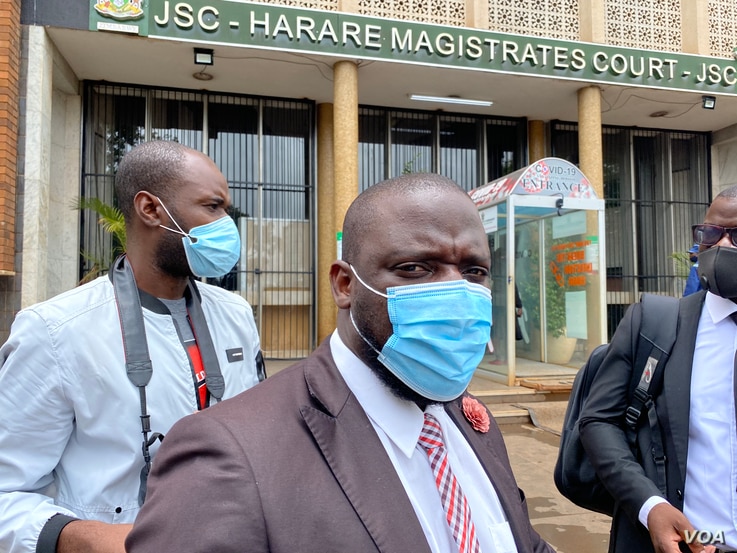 Paidamoyo Saurombe, from Zimbabwe Lawyers for Human Rights, talks to reporters outside Harare Magistrate's Court, Jan. 14, 2021. (Columbus Mavhunga/VOA) 