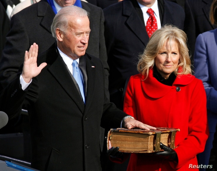 FILE - U.S. Vice President Joe Biden is sworn in as his wife Jill Biden watches during the inauguration of President Barack Obama in Washington, Jan. 20, 2009.