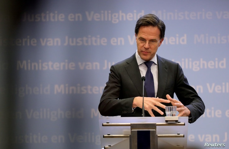 FILE - Dutch Prime Minister Mark Rutte speaks during his news conference in the Hague, Netherlands, March 19, 2020. 