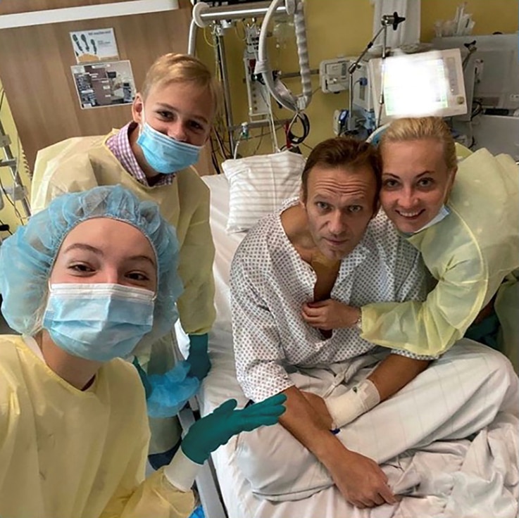 Russian opposition politician Alexei Navalny and his family members pose for a picture at Charite hospital in Berlin, Germany, in this undated image obtained from social media, Sept. 15, 2020. 